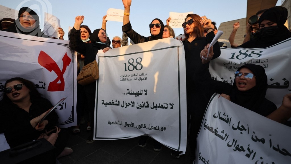 Iraqi women demonstrate against underage marriage in Tahrir Square in central Baghdad on August 8, 2024, amid parliamentary discussions over a proposed amendment to the Iraqi Personal Status Law. Rights advocates are alarmed by a bill introduced to Iraq's parliament that, they fear, would roll back women's rights and increase underage marriage in the deeply patriarchal society. (Photo by AHMAD AL-RUBAYE / AFP)